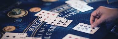tribun slot browser interface on iPhone showing live blackjack and baccarat dealer tables